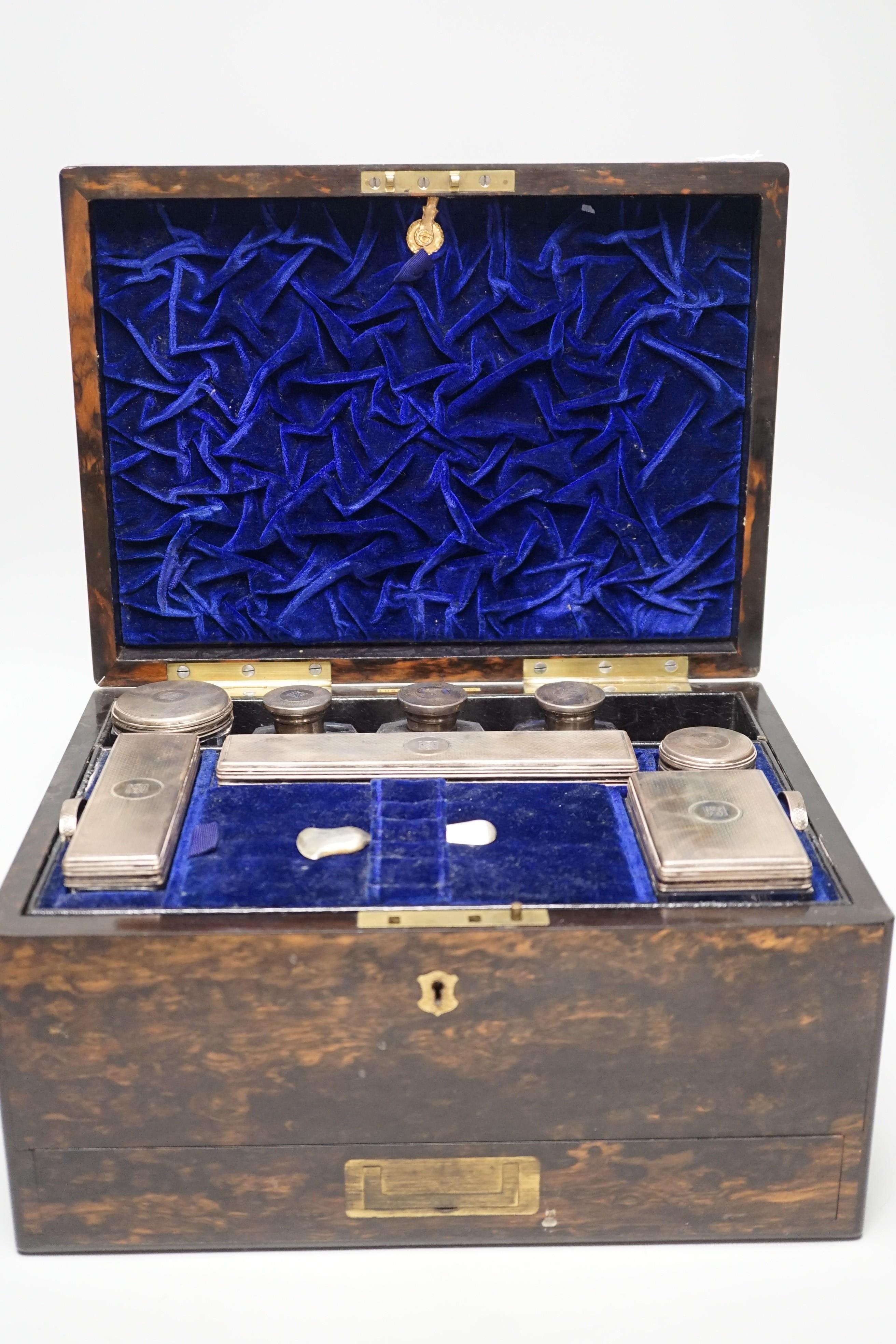 A Victorian brass mounted coromandel wood travelling toilet box, containing eight silver mounted glass toilet jars, all with engraved monogram, Frances Douglas, London, 1851, box width 30.5cm (incomplete and a.f.).